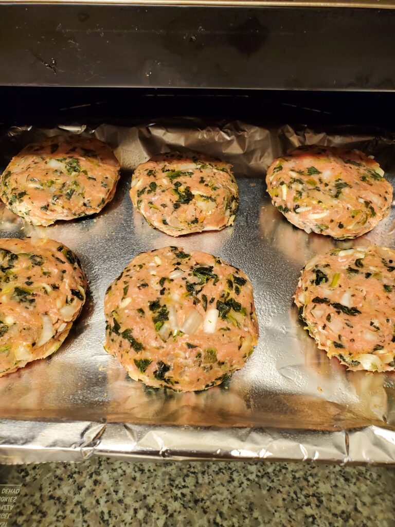 Transfer the Spinach Mozzarella Turkey Burgers to an aluminum lined baking sheets, sprayed with cooking oil.  